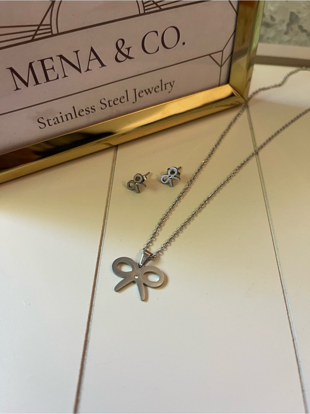 Stainless Steel Silver Bow Pendant Necklace and Stud Earrings Set